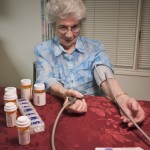 senior woman taking blood pressure