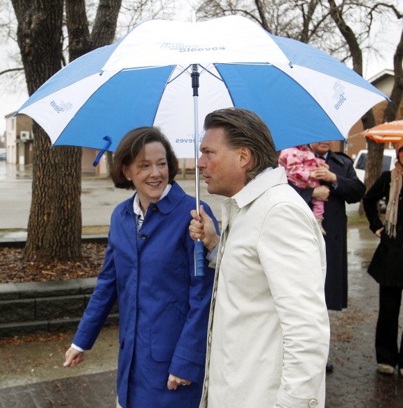 Alberta premier Alison Redford and Education Minister Thomas Lukaszuk walk back to the campaign bus after making an announcement in Edmonton on Friday April 13, 2012. Alberta premier Alison Redford announced that if they win the provincial election the Progressive Conservatives would ensure that police, firefighters and other first responders get proper treatment for Post Traumatic Stress Disorder, the government would include PTSD under Workers' Compensation Board coverage. TOM BRAID/EDMONTON SUN QMI AGENCY