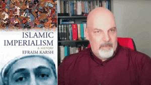 Collin May was fired as Chief of the Albert Human Rights Commission over a scholarly review of Efraim Karsh’s historic book Islamic Imperialism; a champion of free speech and fierce opponent of “cancel culture”, May nonetheless remains optimistic that human rights commissions can serve a purpose if they “refocus on human rights…rather than on identity politics.” (Source of right screenshot: YouTube/Leaders on the Frontier)
