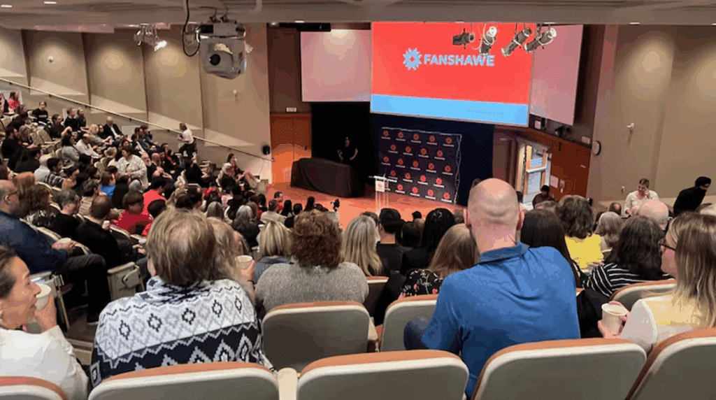 Faced with a provincial tuition freeze and a reduction in its international student intake, Fanshawe College in London, Ontario is laying off 400 full-time employees; fiscal discipline will be needed to correct the out-of-control administrative bloat across other Canadian schools. Shown, several hundred Fanshawe employees are about to hear news on the school’s restructuring, May 2025.