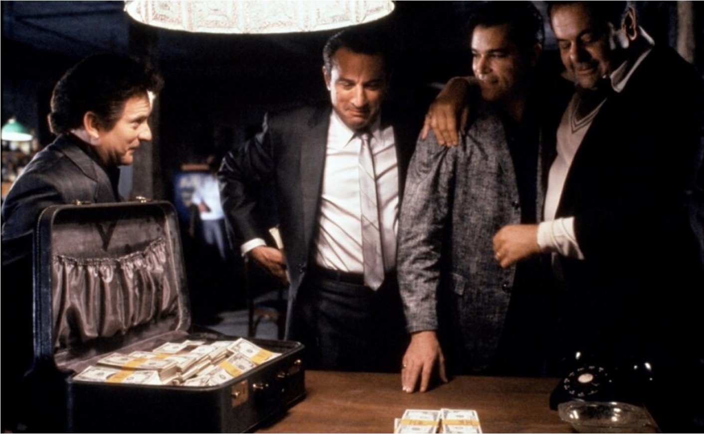 The best criminals went online a long time ago: While Ottawa claims banning large cash transactions is necessary to fight crime and prevent money laundering, that’s mostly a Hollywood myth. Shown, a scene from the 1990 movie Goodfellas featuring Joe Pesci, Robert De Niro, Ray Liotta, Paul Sorvino and a big suitcase full of cash. 