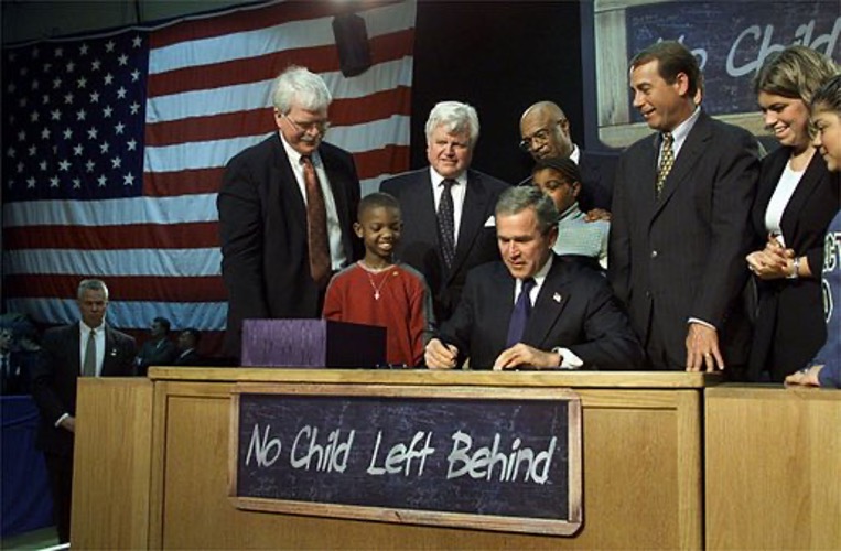 Demand better: The No Child Left Behind Act tackled the “soft bigotry of low expectations” by tracking progress and raising expectations across all schools. Shown, U.S. president George W. Bush signs the bill in Hamilton, Ohio on January 8, 2002. 