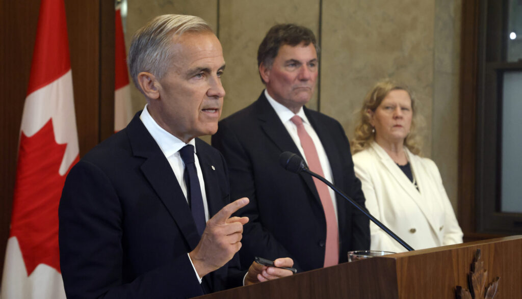 Mais non! Prime Minister Mark Carney has cited Canada’s defence of its “subsidies and support” for French culture as triggering the recent collapse in trade talks; rigid bilingual labelling requirements are yet another reason why Canadians must pay more for their daily essentials. Shown, Carney speaking about Canada-U.S. trade negotiations on August 22, 2026.