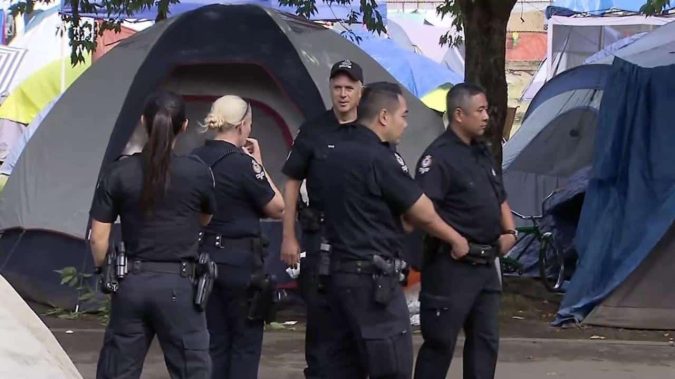 Police attempt to deal with the issue of Vancouver's homeless camps, but often people just move to other parks.