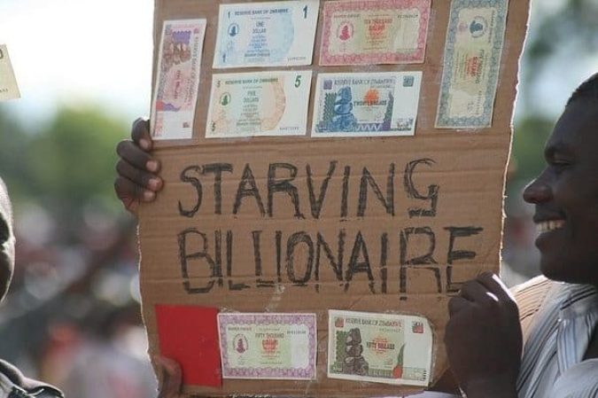 One solution to national debt problems is for government's to "inflate" their way out. A strategy being protested in this picture.